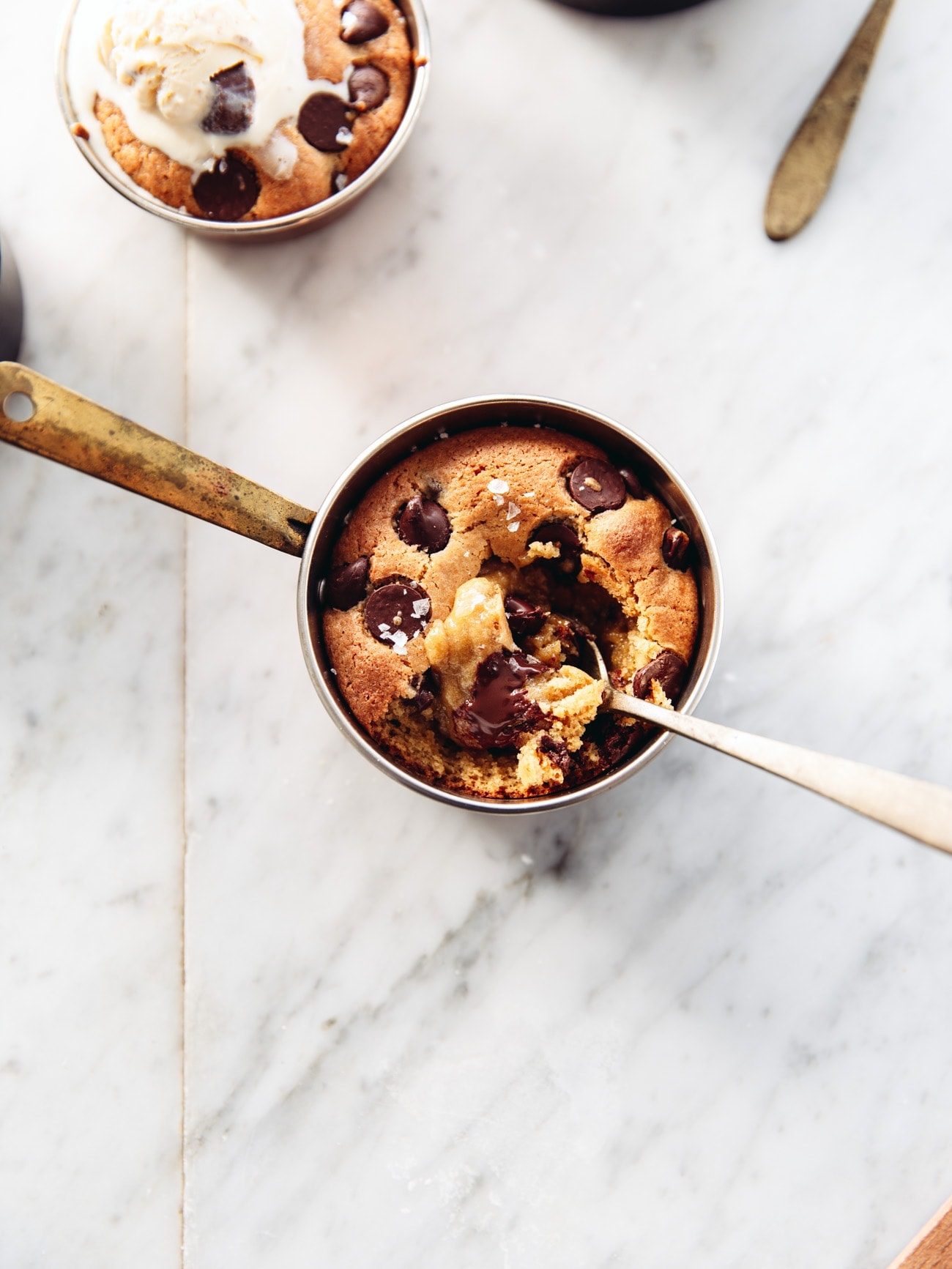 A cookie dough pot with a scoop taken out