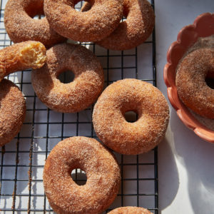 spiced easter doughnuts on a wire rack