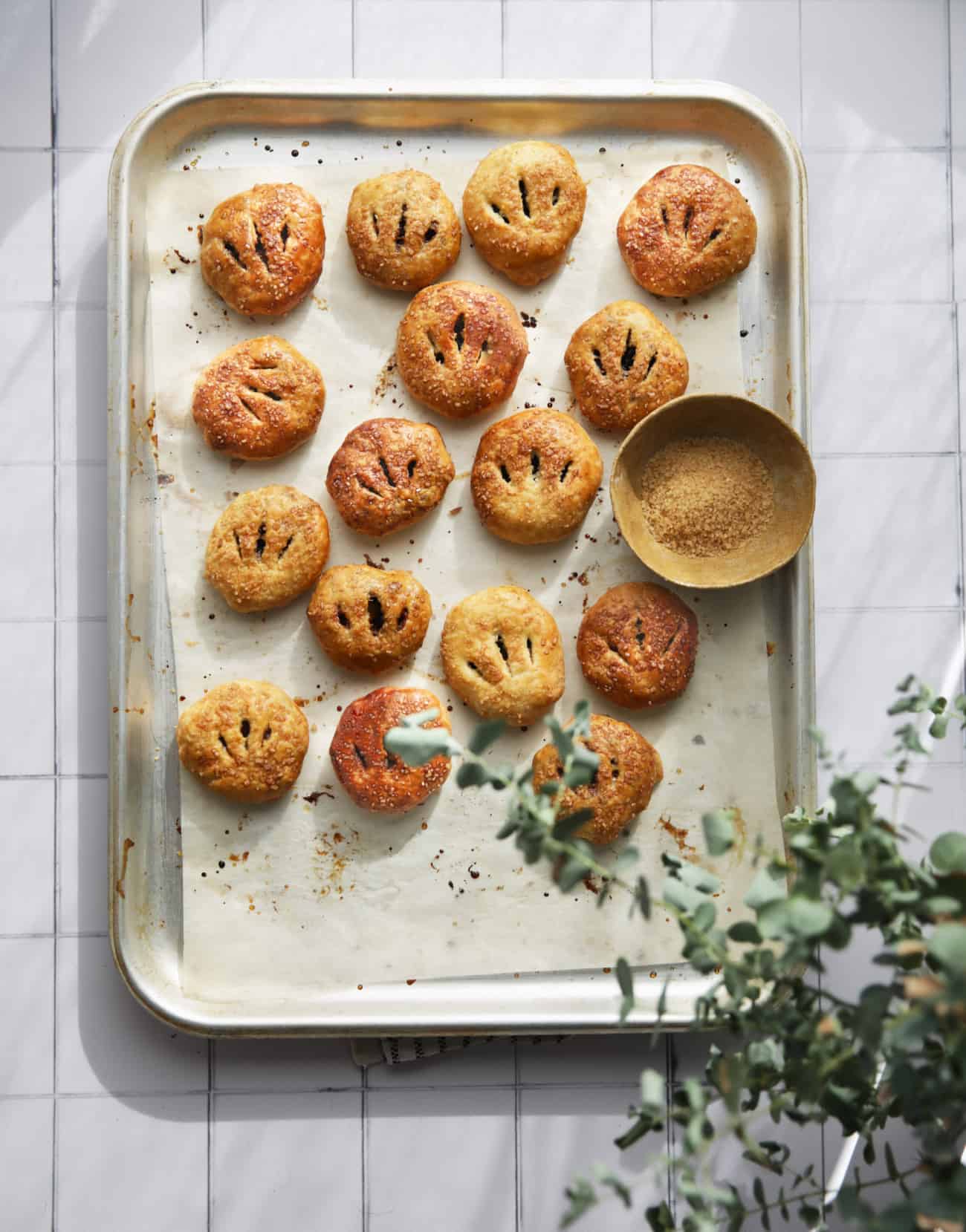 Eccles cakes on a baking tray