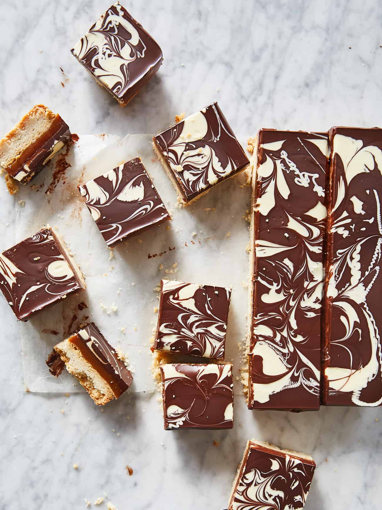 overhead shot of squares of millionaire's shortbread with marbled chocolate