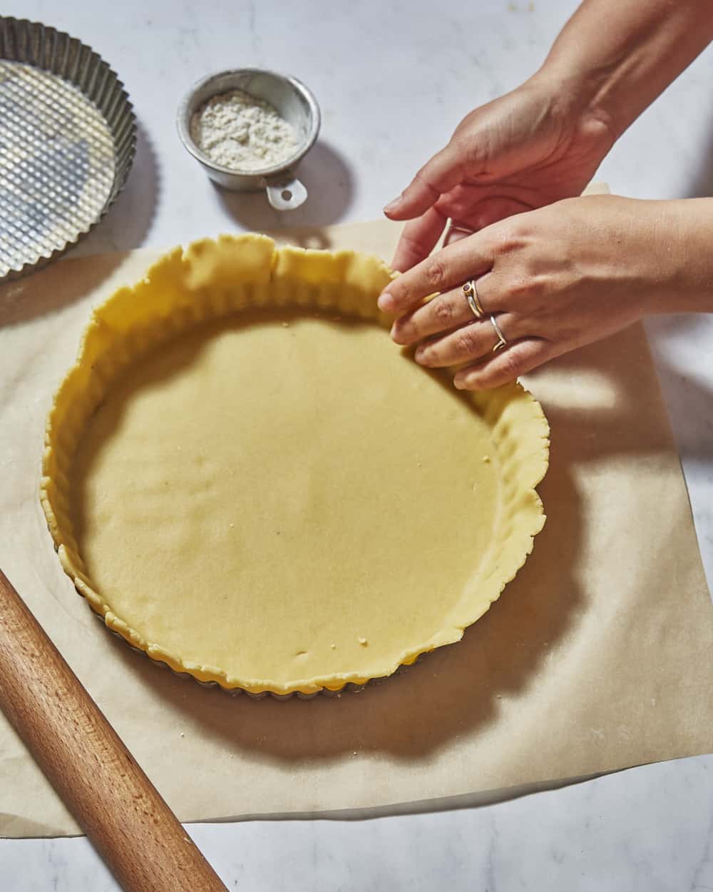 lining tart tin with shortcrust pastry