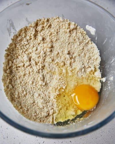 adding egg to shortcrust pastry