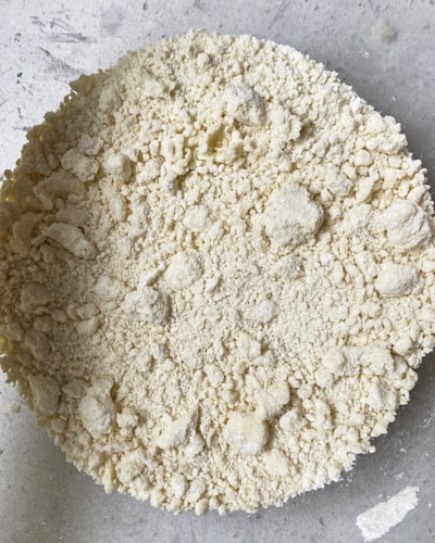 shortcrust pastry mixture with large lumps of butter remaining