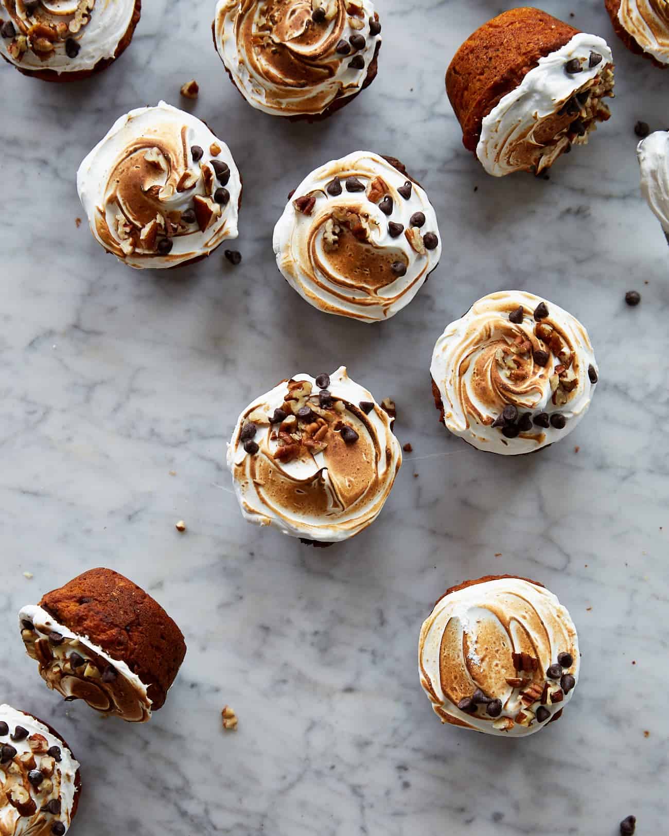 Sweet potato cupcakes with meringue frosting on a marble background