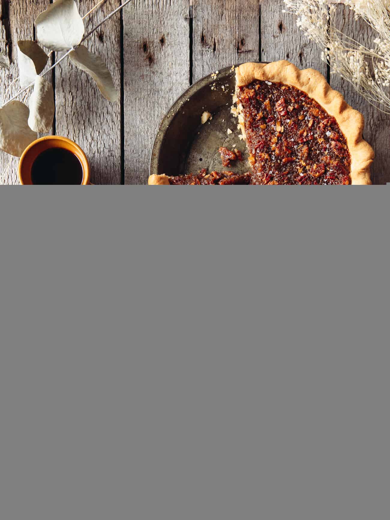 overhead image of vegan maple pecan pie with two slices removed