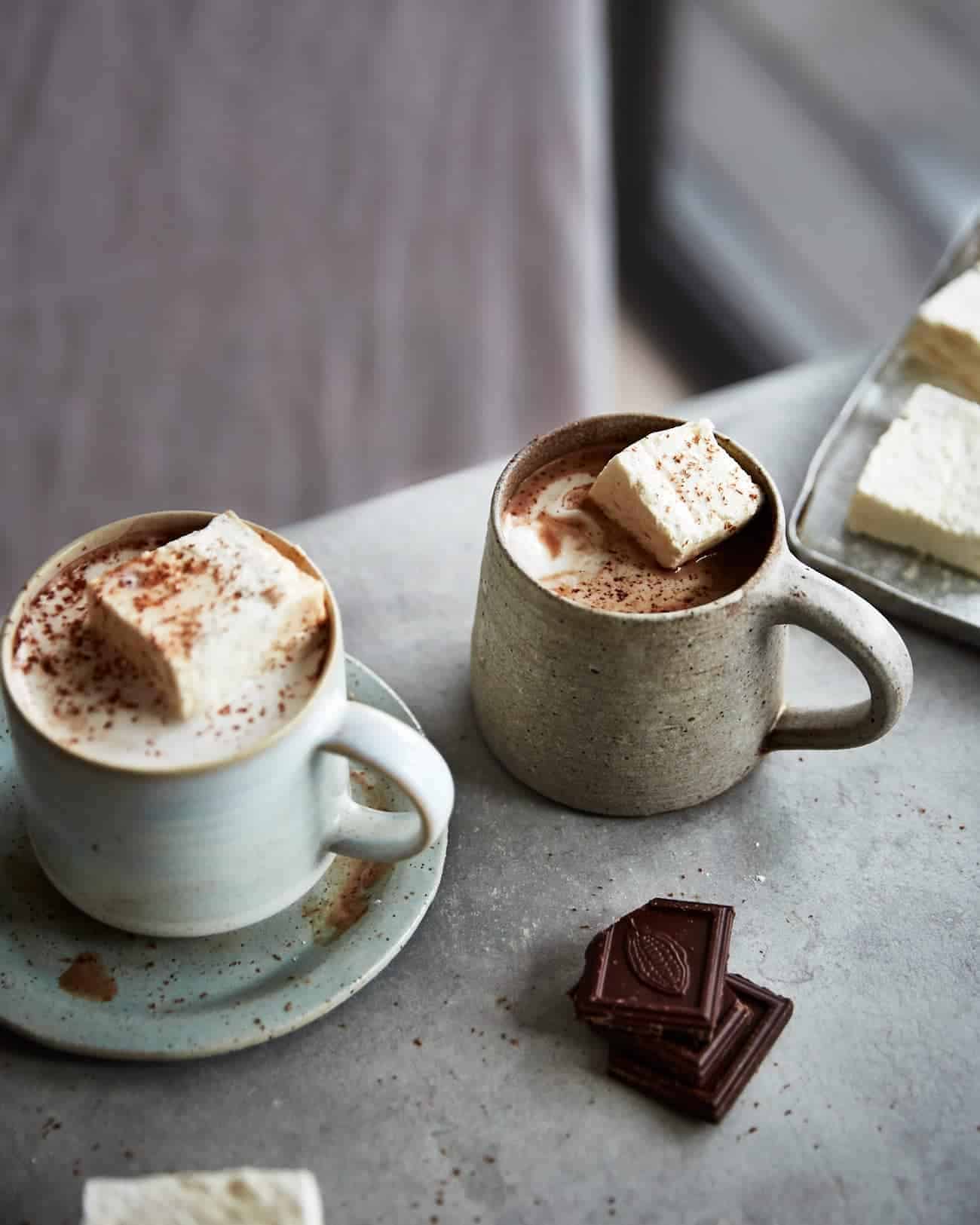 two mugs of hot chocolate with vegan marshmallows